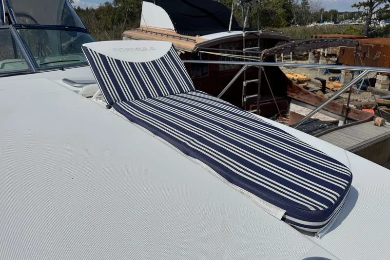 Slide: The Image of 2011 Formula 37 Performance Cruiser with striped sunbed on deck. - 23
