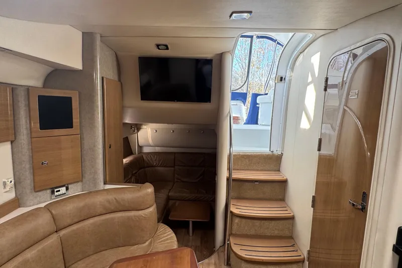 Slide: The Image of Interior of 2011 Formula 37 Performance Cruiser with seating, TV, and wooden accents. - 26