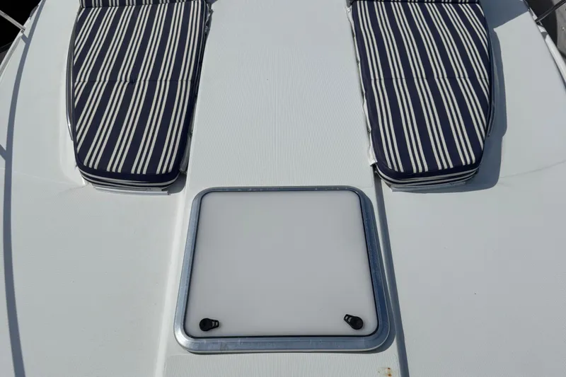 Slide: The Image of 2011 Formula 37 Performance Cruiser deck with striped cushions and hatch. - 28