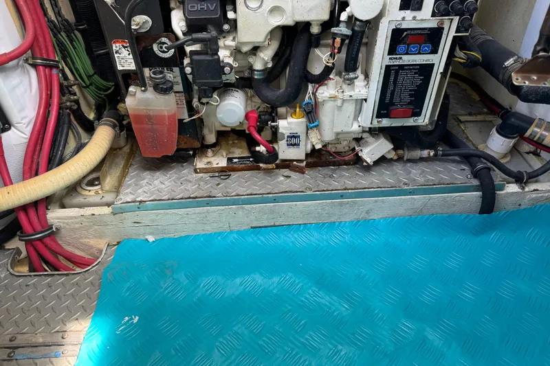 Slide: The Image of Engine compartment of a 2011 Formula 37 Performance Cruiser with visible wiring and components. - 36