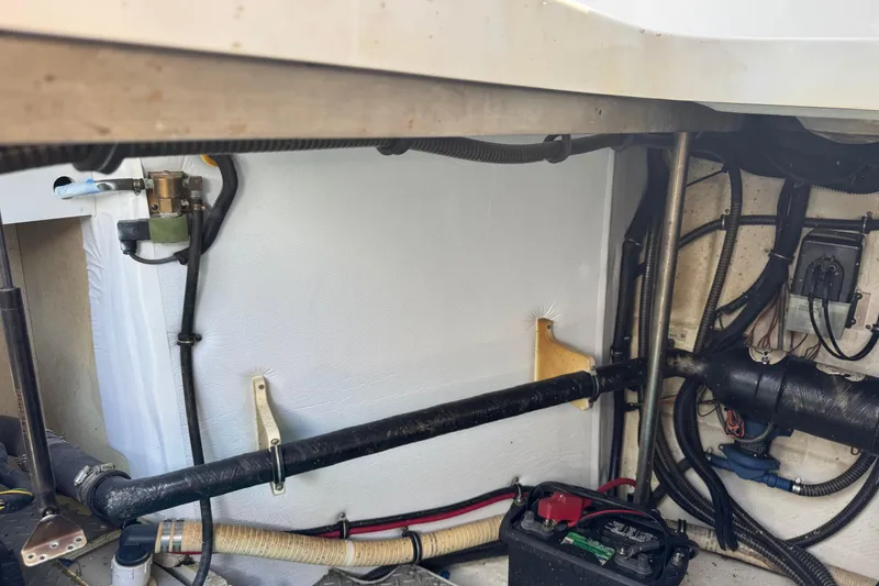 Slide: The Image of Engine compartment of a 2011 Formula 37 Performance Cruiser, showing wiring and components. - 38