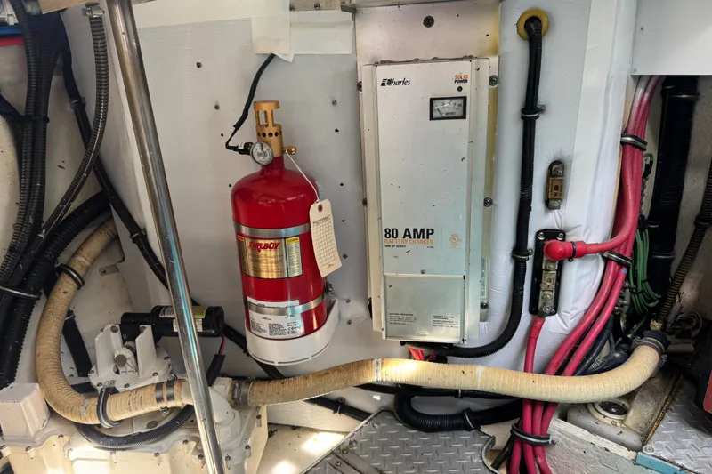 Slide: The Image of Engine room of 2011 Formula 37 Performance Cruiser with fire extinguisher and battery charger. - 40