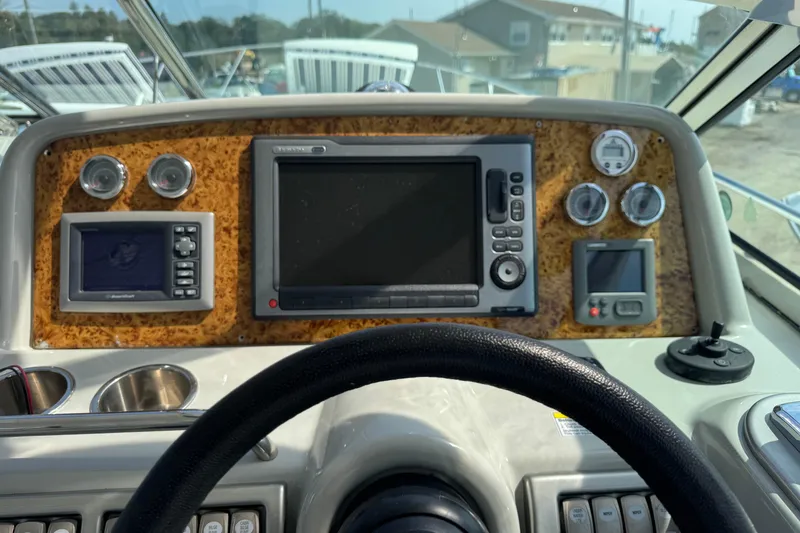 Slide: The Image of Dashboard of a 2011 Formula 37 Performance Cruiser with navigation and control instruments. - 44