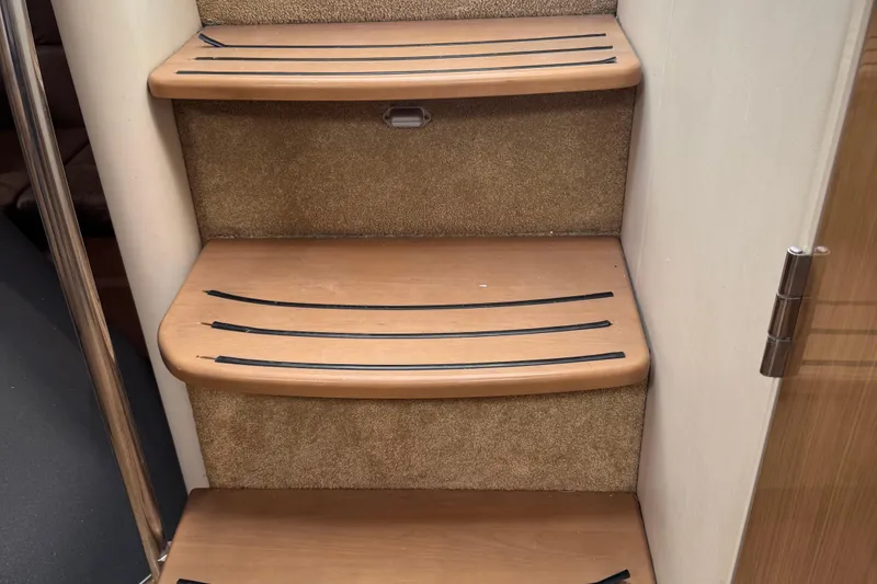 Slide: The Image of Wooden steps with non-slip strips on a 2011 Formula 37 Performance Cruiser. - 45