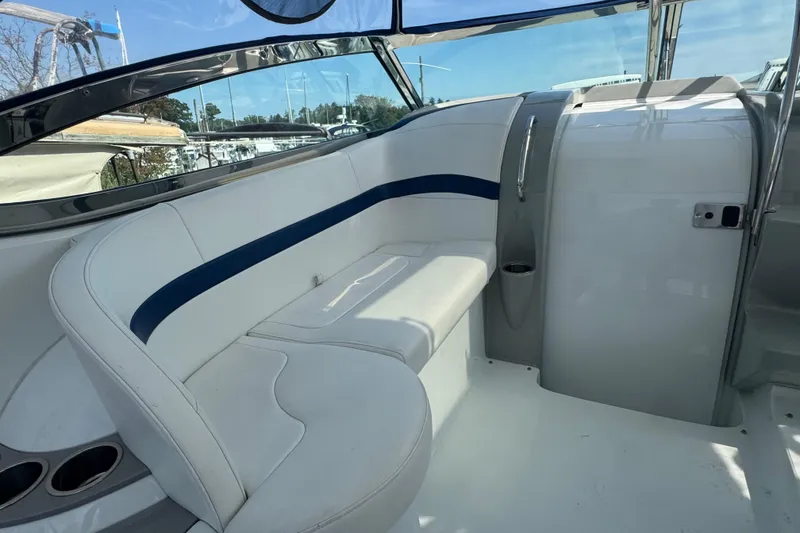 Slide: The Image of 2011 Formula 37 Performance Cruiser interior with white seating and blue accents. - 48