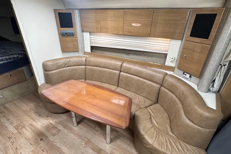 Slide: The Image of Luxurious interior of 2011 Formula 37 Performance Cruiser with leather seating and wooden table. - 51