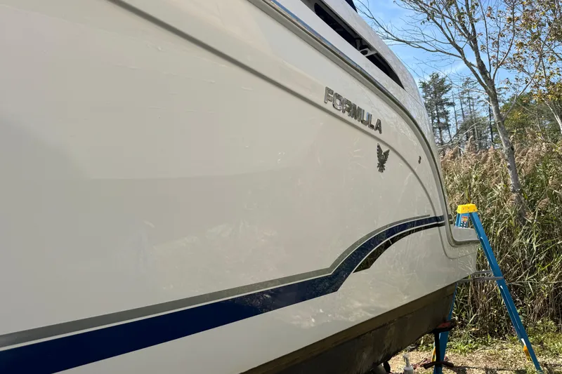 Slide: The Image of 2011 Formula 37 Performance Cruiser boat side view with logo and ladder. - 6