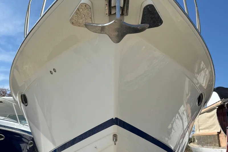 Slide: The Image of 2011 Formula 37 Performance Cruiser boat, close-up of bow and anchor, under clear blue sky. - 9