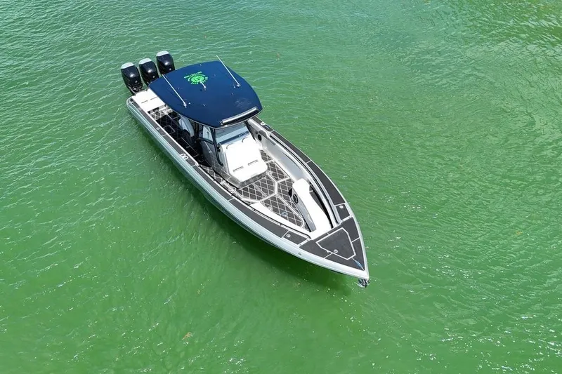 Slide: The Image of Aerial view of 2016 Statement 380 Open boat on green water. - 9