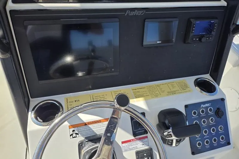 Slide: The Image of 2025 Parker 2400 Center Console dashboard with steering wheel and electronic displays. - 12