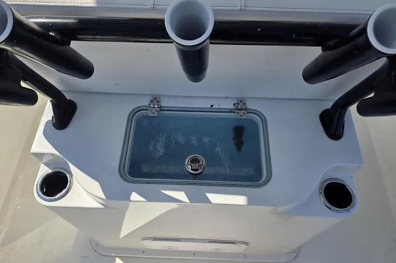 Slide: The Image of 2025 Parker 2400 Center Console boat with rod holders and storage compartment. - 14