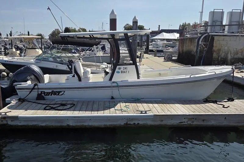 Slide: The Image of 2025 Parker 2400 Center Console boat docked at a marina. - 4