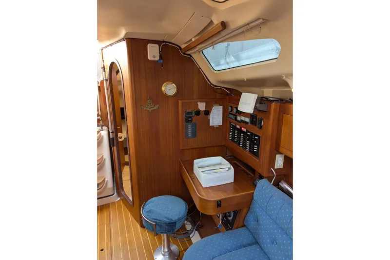 Slide: The Image of Interior of 1998 Hunter 376 sailboat with navigation station and wooden cabinetry. - 27