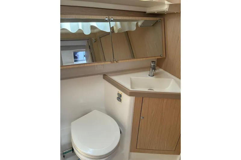 Slide: The Image of Bathroom interior of 2020 Beneteau Oceanis 41.1 yacht, featuring sink and mirror. - 16