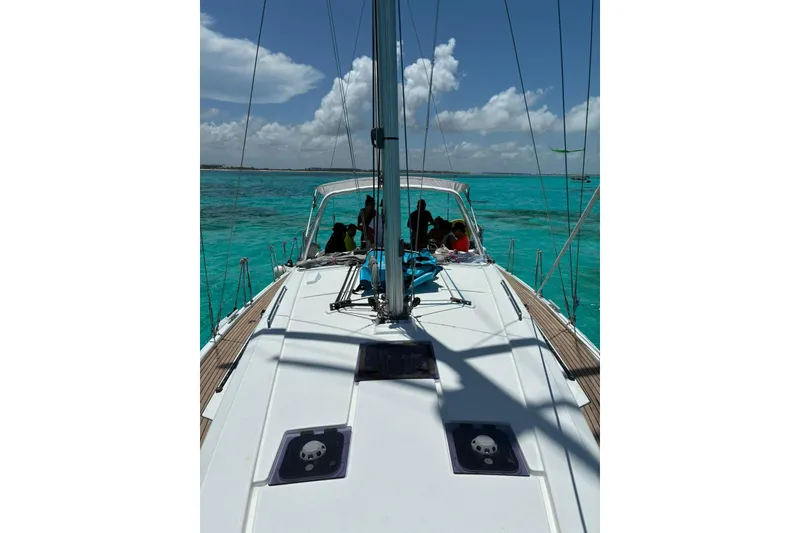 Slide: The Image of 2020 Beneteau Oceanis 41.1 sailing on turquoise waters under a clear sky. - 4