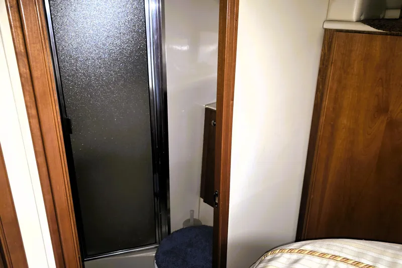 Slide: The Image of 2004 Meridian 391 Sedan interior bathroom with shower and wooden accents. - 10