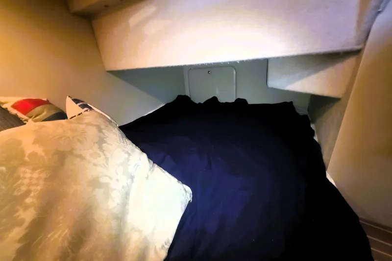 Slide: The Image of Cozy sleeping area in 2004 Meridian 391 Sedan yacht with pillows and bedding. - 16