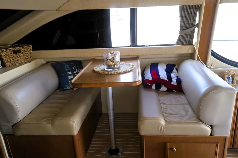 Slide: The Image of Interior of 2004 Meridian 391 Sedan yacht with cozy seating and decorative pillows. - 18