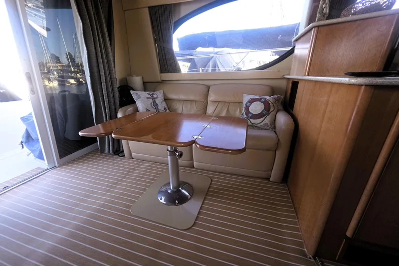 Slide: The Image of Interior of 2004 Meridian 391 Sedan yacht with sofa and wooden table. - 21