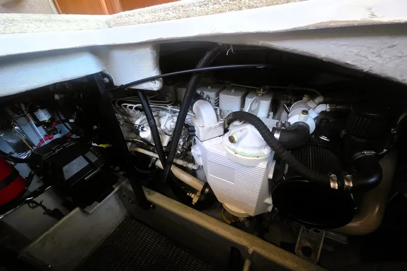 Slide: The Image of Engine compartment of 2004 Meridian 391 Sedan yacht, showcasing mechanical components and wiring. - 23