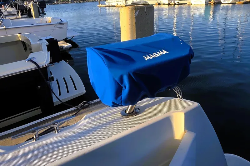Slide: The Image of Blue Magma grill cover on 2004 Meridian 391 Sedan boat at marina. - 27