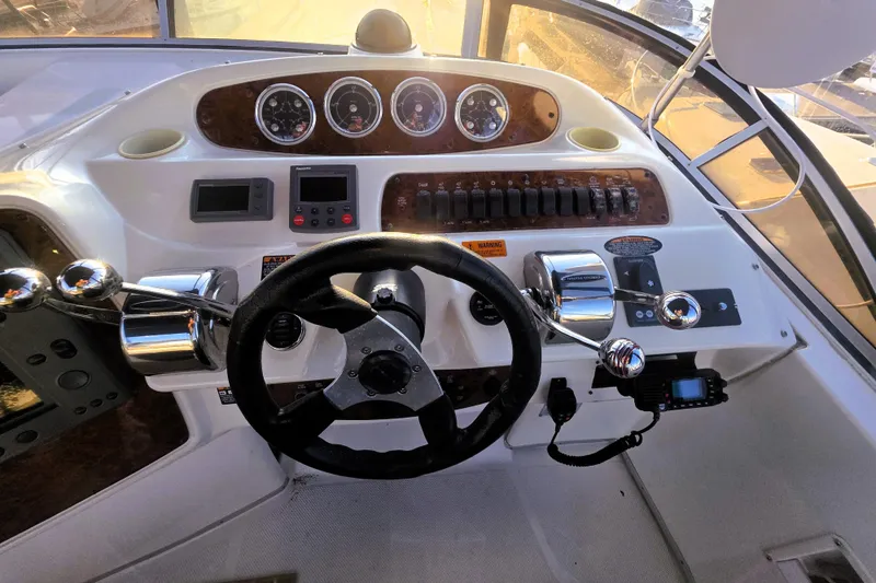 Slide: The Image of 2004 Meridian 391 Sedan helm with steering wheel, gauges, and controls. - 29