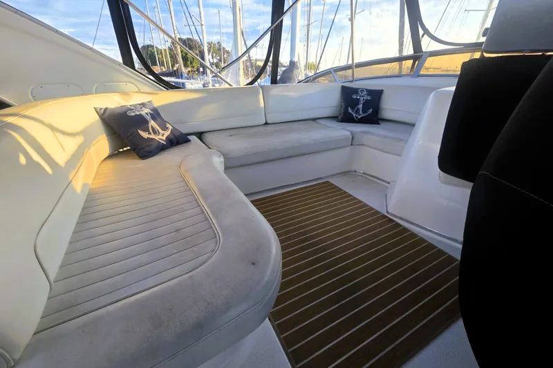 Slide: The Image of Luxurious 2004 Meridian 391 Sedan yacht interior with cushioned seating and nautical decor. - 31