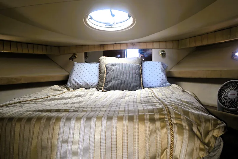 Slide: The Image of Luxurious cabin interior of 2004 Meridian 391 Sedan yacht with cozy bedding. - 6
