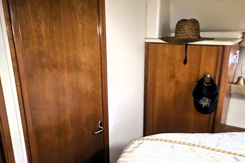 Slide: The Image of Interior of 2004 Meridian 391 Sedan with wooden cabinetry and hanging hats. - 8