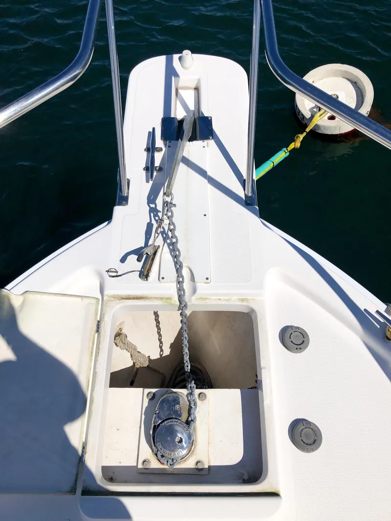 Slide: The Image of 2003 Mainship 30 Pilot II Hardtop boat deck with anchor chain and mooring buoy. - 19
