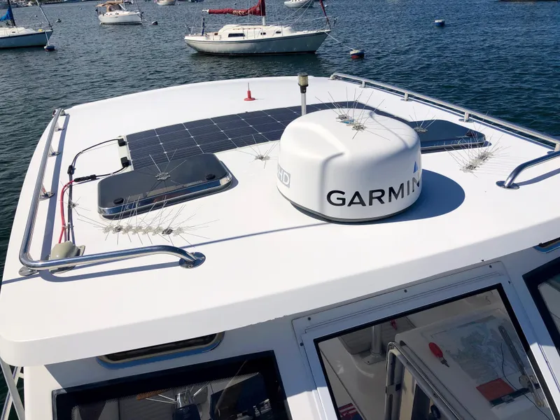 Slide: The Image of 2003 Mainship 30 Pilot II Hardtop with Garmin radar and solar panels on the roof. - 21