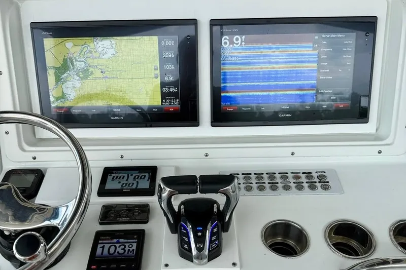 Slide: The Image of 2006 Yellowfin 36 Offshore boat with Yamaha engines on a calm river. - 5