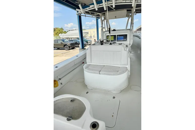 Slide: The Image of 2006 Yellowfin 36 Offshore boat with triple outboard engines on calm water. - 8