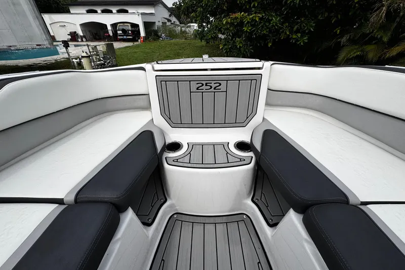 Slide: The Image of 2022 Yamaha Boats 252SE interior with sleek seating and modern design. - 19