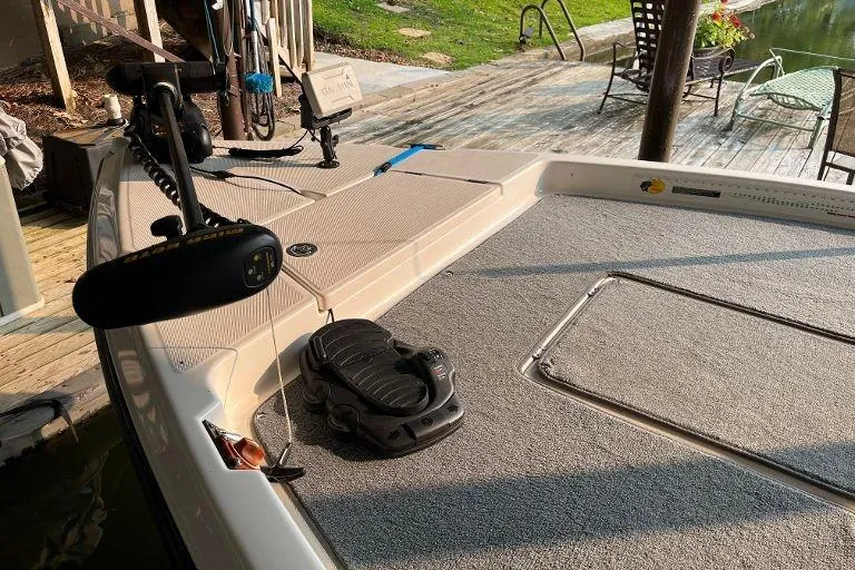 Slide: The Image of 2007 Century 2102 boat deck with fishing equipment, dockside view. - 12