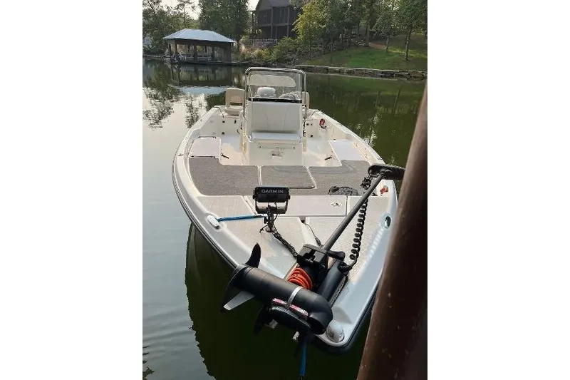Slide: The Image of Century 2102 boat, 2007 model, docked on a calm lake with trees in the background. - 5