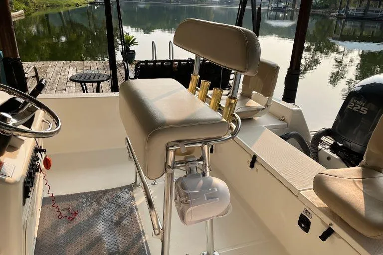 Slide: The Image of Interior of a 2007 Century 2102 boat with seating and lake view. - 9