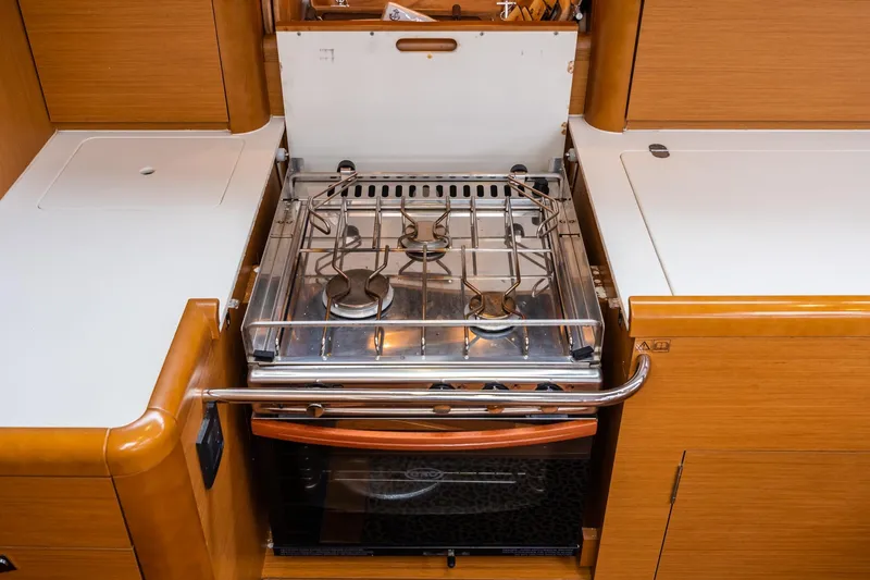 Slide: The Image of 2013 Jeanneau 57 yacht deck with winch and seating area. - 21