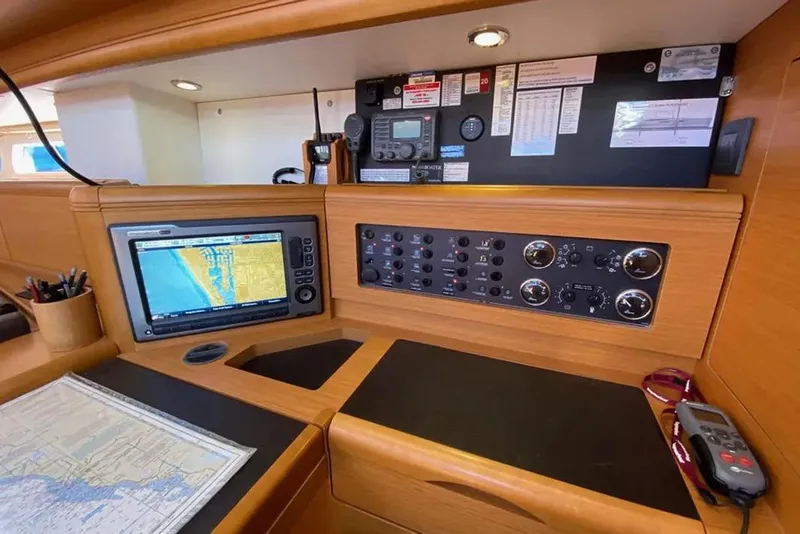 Slide: The Image of Luxurious interior of a 2013 Jeanneau 57 yacht with modern furnishings and wood finish. - 26