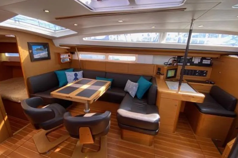 Slide: The Image of Luxurious interior of 2013 Jeanneau 57 yacht with modern kitchen and seating area. - 29