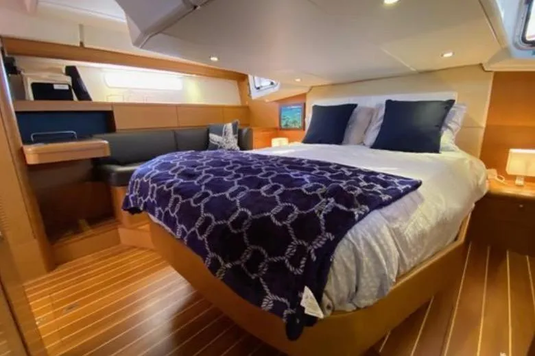 Slide: The Image of Luxurious interior of a 2013 Jeanneau 57 yacht with modern amenities and elegant design. - 34