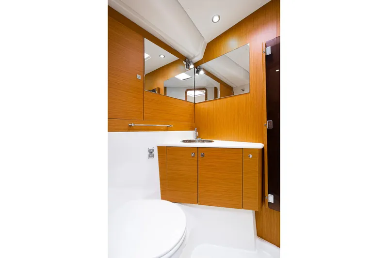 Slide: The Image of Interior of 2013 Jeanneau 57 yacht with navigation station and seating area. - 35