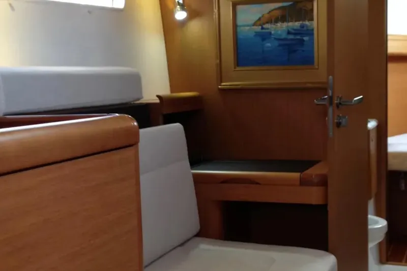 Slide: The Image of Interior of 2013 Jeanneau 57 yacht with cozy bunk beds and wooden finish. - 43