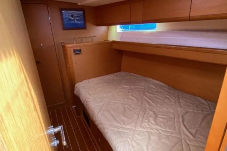 Slide: The Image of 2013 Jeanneau 57 yacht bathroom with wooden accents and compact design. - 47
