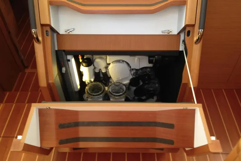 Slide: The Image of Luxurious interior of a 2013 Jeanneau 57 yacht with elegant wood finishes and modern amenities. - 51