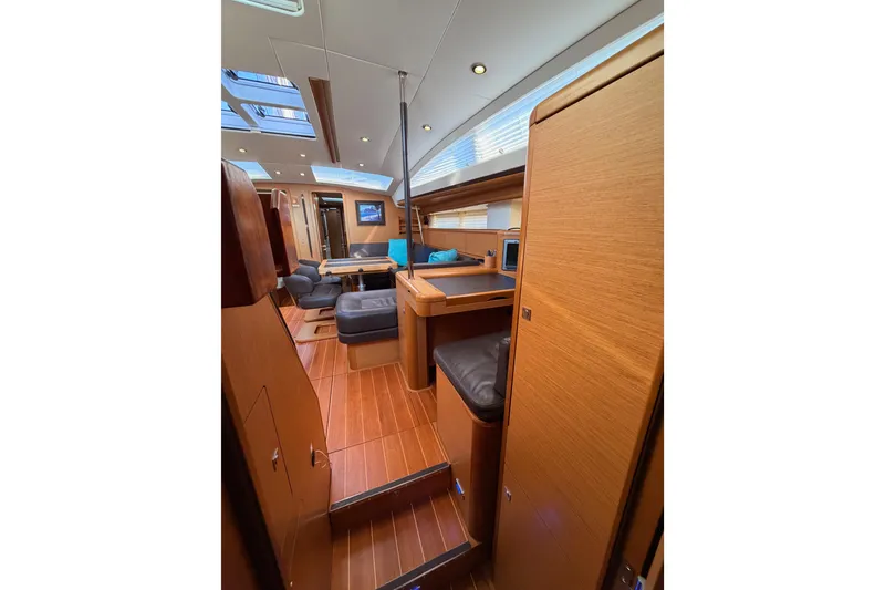 Slide: The Image of Luxurious interior of 2013 Jeanneau 57 yacht with wood finish and modern seating. - 64