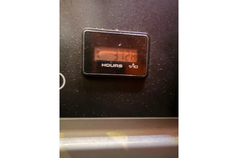 Slide: The Image of Hour meter displaying 3128 hours on a 2013 Jeanneau 57 yacht. - 69