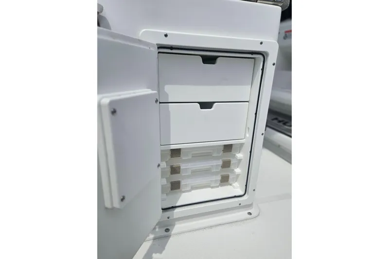 Slide: The Image of Storage compartment on 2025 Sea Hunt Gamefish 27 Forward Seating boat. - 13