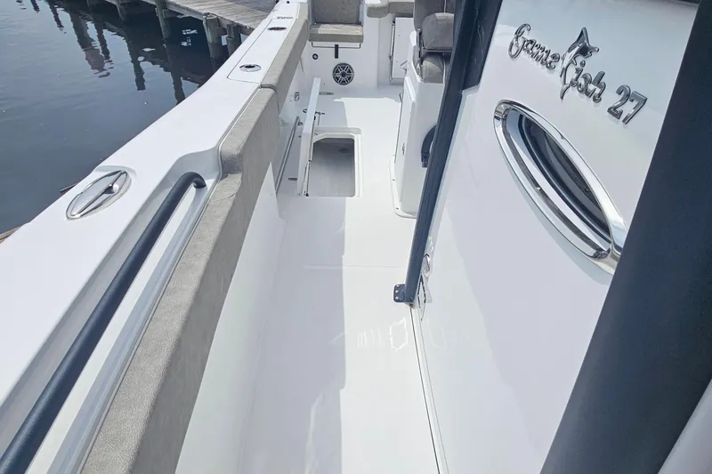 Slide: The Image of 2025 Sea Hunt Gamefish 27 Forward Seating boat interior, featuring sleek design and spacious layout. - 17