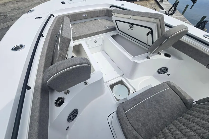 Slide: The Image of 2025 Sea Hunt Gamefish 27 Forward Seating with gray upholstery and storage compartments. - 31